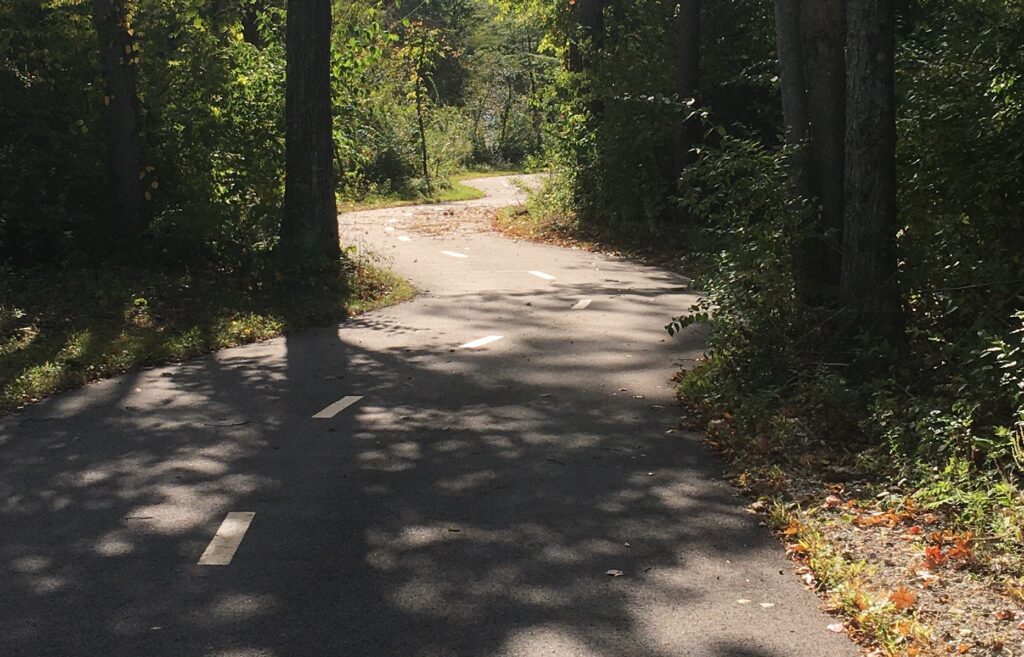 Paved ADA-accessible hiking trail on the Olentangy Greenway Trail in Columbus, Ohio.